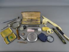 A silver vesta case thimble and posy holder, a selection of vintage pens and pencils, a circa 1910