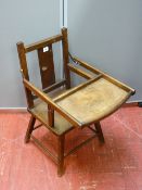 A vintage oak child's seat with foldover tray, 68 cms high