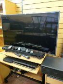 A Samsung curved flatscreen TV mod UE55J586002, Yamaha digital sound projector YSP2200, a