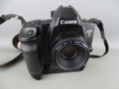 A Canon EOS3 camera with 50mm lens