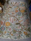 A vintage needlework rug 170cm x 125cm approximately, decorated with birds among flowering