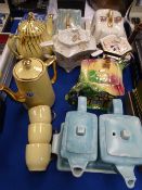 Collection of vintage teapots and cheese dishes with covers