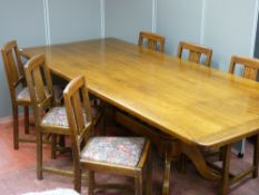 A reproduction oak twin pedestal dining table, 238 cms long (shrinkage splits to top) and six