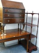 A mid Century teak twin flap dining table, a vintage mahogany fall front bureau and a reproduction