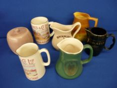 Five ale and whisky advertising water jugs, a satin glazed biscuit barrel with lid, makers include