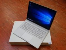 Boxed Microsoft 'Surface Book' laptop with pen