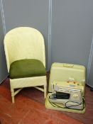 A Singer electric sewing machine and wicker bedroom chair E/T