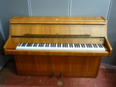 A Bentley lightwood upright piano