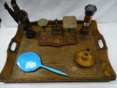 A vintage oak two handled tray, a set of antique postal scales, a carved Oriental hardwood figure
