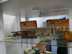 A boxed Unity toy, famous 17 millimetre field gun, three tin plate tanks, a British made friction