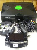 Hand held Sony PSP and an XBox console