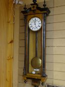 Victorian Vienna style wall clock, the dial marked 'R Helliwell, Buxton', single weight pendulum