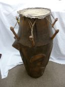 African type drum with carved figural detail, 80 cms high