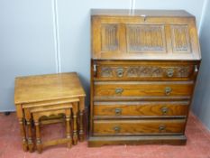 Priory style oak fall front bureau with linenfold and carved detail and a set of three