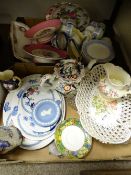 A mixed selection of decorative pottery and porcelain tableware including a reticulated floral