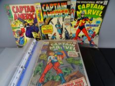 Marvel comics - twenty five contained in a sleeved album along with two DC comics and two others