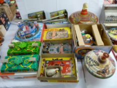 Selection of mechanical tinplate toys, two vintage spinning tops and one other, mainly boxed with