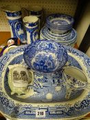A quantity of Willow pattern dinnerware including four 45cms serving platters, a set of three flow