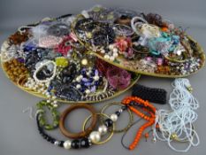 An excellent quantity of vintage and later costume jewellery displayed on two trays