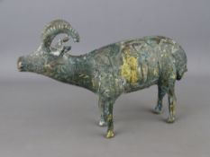 A Persian gilt decorated brass Ibex ram, 15 cms high and 21 cms long