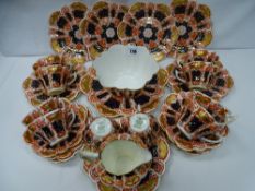 A thirty two piece Wileman & Co Foley china teaset in Imari style decoration