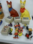 Pair of papier mache seated cats, a group of Mickey Mouse and Donald Duck clockwork toys from the