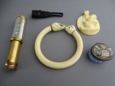 A Bilston type enamel patch box titled 'We live in Hope', a Victorian ivory bangle with elephant