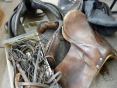 Four various leather horse saddles with a quantity of reins, straps and other tack