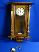 Pendulum driven Vienna style wall clock, 70 cms high with pendulum and key