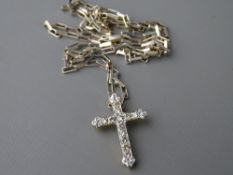 Eighteen carat gold cross, encrusted with twelve round cut diamonds, 2 grms gross and a 925 silver