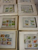 Fifteen framed sets of world postage stamps, 1960s/70s dates, designed by J Waddington Ltd