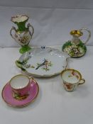 A handpainted decorated dish, blue cross swords mark, 26 cms wide and similar items