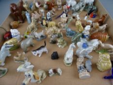 A quantity of Wade Whimsy porcelain animals with other miniature collectables