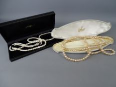Cased twin row cultured pearl necklace of graduated beads, with nine carat gold circular seed