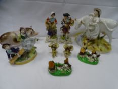 An unmarked pottery figure of a boar, four small antique spillholders, three probably Continental