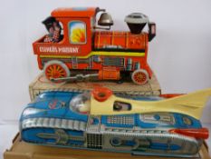 KIBE battery model of a futuristic car and a tinplate model of a steam locomotive, same