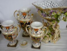 Garniture set of three 'Old Derby Imari' campana style vases and a Continental porcelain figure