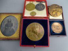 A cased daguerreotype of a young girl, two World War I medals awarded to 280546 PNR Clark RE, a