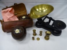 A pair of vintage wooden bowling balls with ivory button detail in carry case and a reproduction set