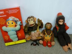 Two battery operated monkey toys and one other and a boxed Playschool 'Glow Worm'