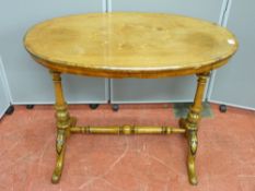 A Victorian walnut side table with floral inlay on carved and turned supports with cross stretcher