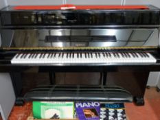 A modern Daewoo Royale black lacquered upright piano with matching stool