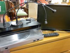 A Samsung flatscreen TV, Sony Blu-ray disc player, stylish table lamps, DVDs etc E/T