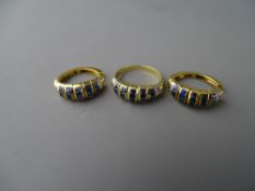 Fourteen carat gold sapphire and cz dress ring, the sapphires set in five triples, size 'N/O', 3.3