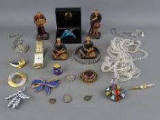 A set of four composition figures oriental workers, a selection of vintage costume jewellery