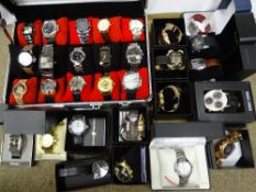 Approximately thirty modern mainly gent's fashion watches, in apparently as new condition