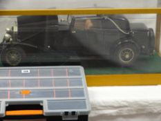 Large scale cased model of a 1932 Rolls Royce Phantom II coupe, a pictorial image of a Rolls Royce