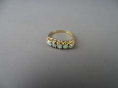 Nine carat gold five stone opal dress ring, 2.2 grms gross, size 'O/P'