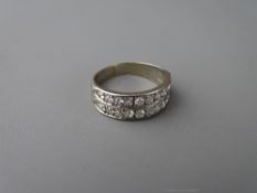 An eighteen carat gold double diamond set half eternity ring having twenty number 0.06 carat