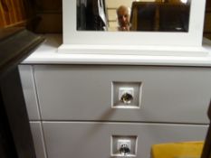 Suite of white coloured modern bedroom furniture comprising chest of three drawers, narrow chest and